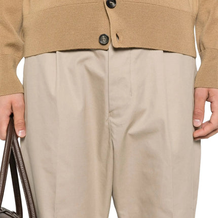 Model Detailed Front View of Ami Paris Carrot Oversized Trousers Beige